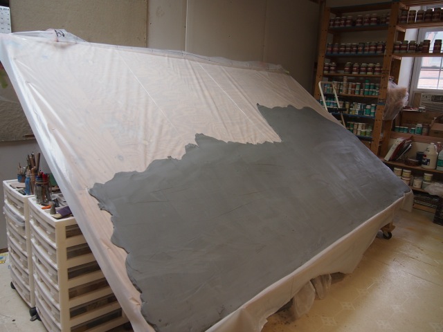 Laying out the clay onto our large easel. 
