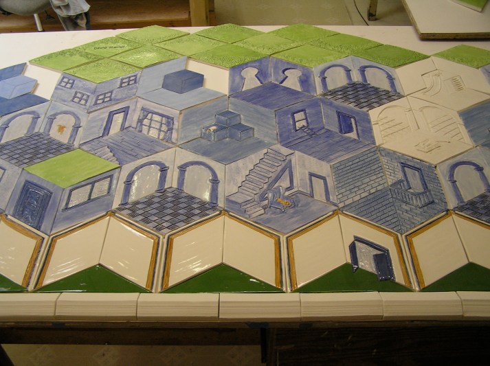 Donor recognition wall for the Pilot School laid out in the studio. Notice the details like the dog on the chair. This is a school that allows dogs!